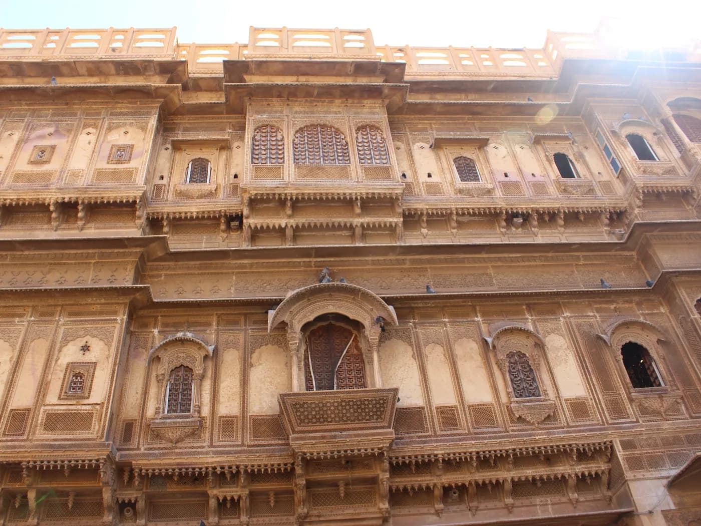 Carved sandstone balconies and jali screens of Patwon Ki Haveli in Jaisalmer