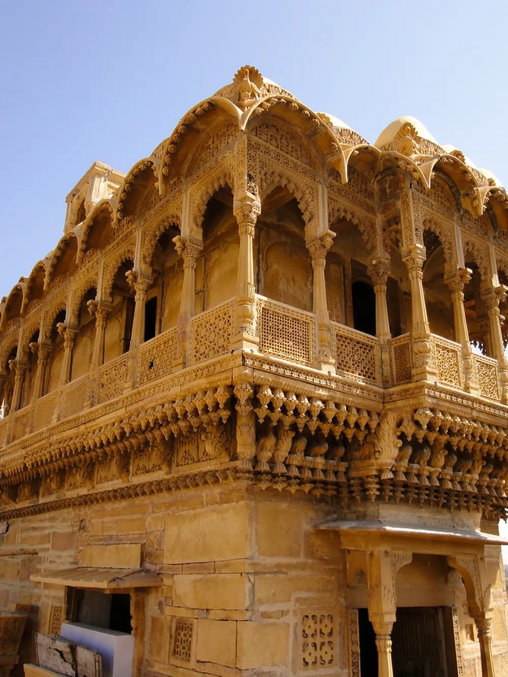 A carved sandstone jharokha balcony on a haveli in Jaisalmer